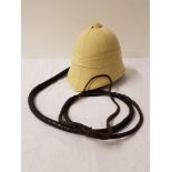 MODERN PITH HELMET with adjustable headband and chinstrap; together with a leather plaited bull whip