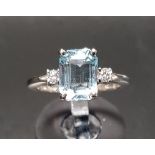 AQUAMARINE AND DIAMOND THREE STONE RING the central emerald cut aquamarine approximately 0.7cts