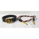 GUCCI BLACK LEATHER BELT with a double G brass buckle, in bag; together with a Gucci tri-colour rope