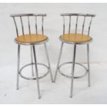 PAIR OF TUBULAR STEEL KITCHEN STOOLS with shaped backs above circular beech seats, 96cm high (2)