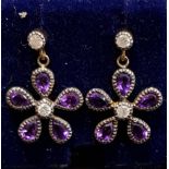 PAIR AMETHYST AND DIAMOND CLUSTER EARRINGS the flower head drops on each formed with pear cut