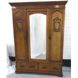 ART NOUVEAU MAHOGANY WARDROBE with a moulded dentil cornice above a shaped central bevelled mirror