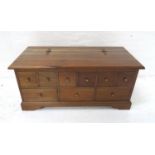 MAHOGANY LOW OCCASIONAL TABLE modelled as a chest with a lift up lid with decorative hinges above an