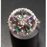 MYSTIC TOPAZ AND DIAMOND CLUSTER RING the five oval cut topaz gemstones with central diamond and