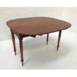 LATE VICTORIAN MAHOGANY TABLE with shaped drop flaps and a single frieze drawer, standing on