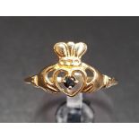 SAPPHIRE SET NINE CARAT GOLD CLADDAGH RING the small round cut sapphire to the centre of the