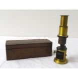 BRASS TABLE MICROSCOPE complete with tweezers and single slide, in mahogany box