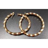 PAIR OF NINE CARAT GOLD HOOP EARRINGS of twist design, approximately 4.2 grams