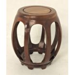 CHINESE ZITAN BARREL SHAPED STAND with a circular top above shaped supports 45cm high