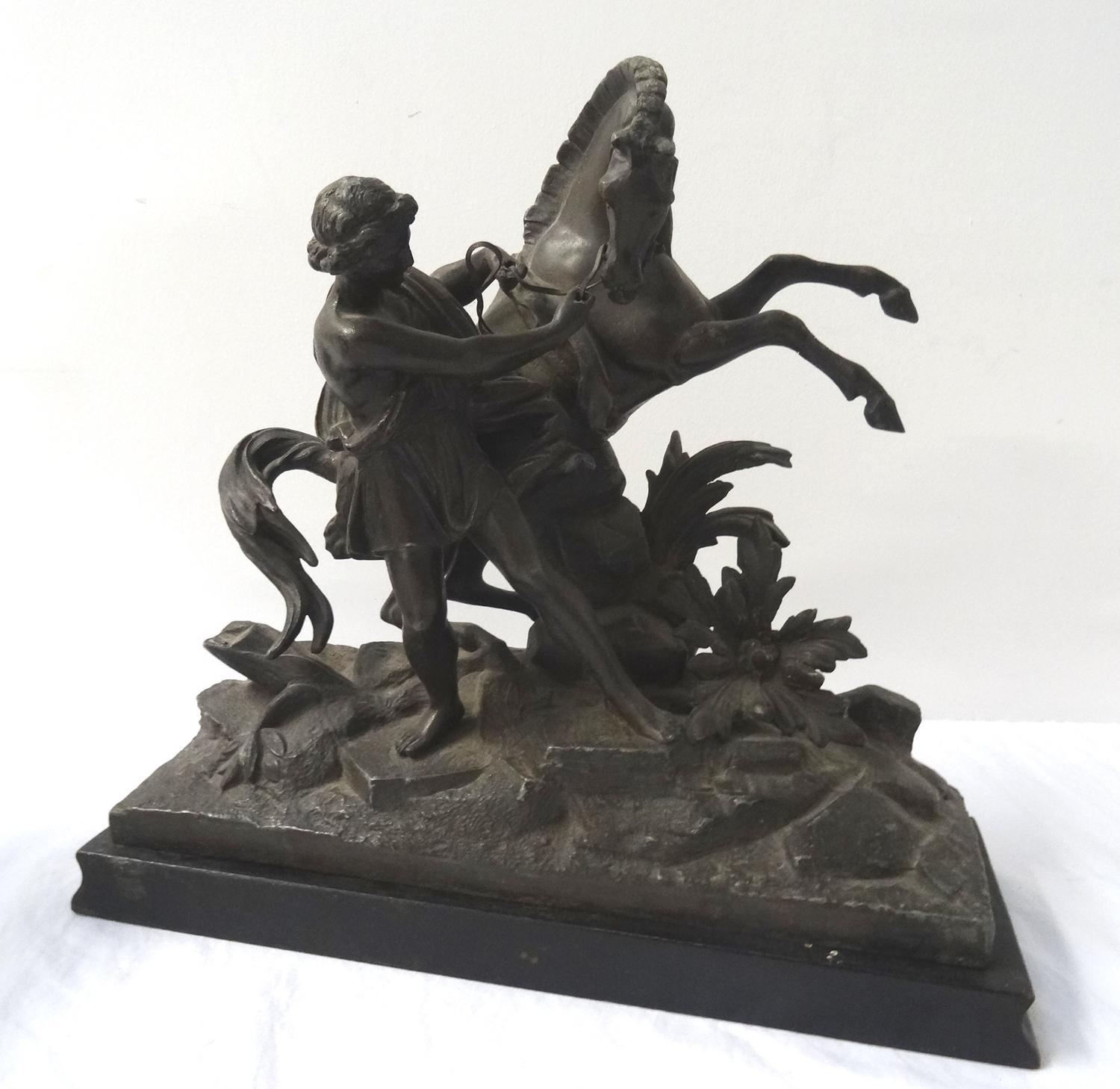 TWO SPELTER FIGURINES each depicting a man trying to control a rearing horse, raised on ebonised - Image 2 of 3