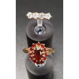GARNET CLUSTER RING on nine carat gold shank, ring size M-N; together with a CZ four stone ring,