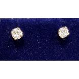 PAIR OF DIAMOND STUD EARRINGS the round brilliant cut diamonds totalling approximately 0.2cts, in