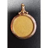 NINE CARAT GOLD MOUNTED DOUBLE SIDED LOCKET PENDANT each side with circular glazed panel