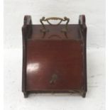 EDWARDIAN COAL SCUTTLE with a brass shaped carry handle and pierced shaped sides above a slanting