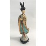CHINESE CLOISONNE FIGURE of a lady in flowing robes, on a hardwood stand, 40cm high