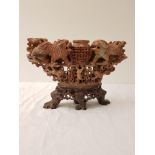 CARVED CHINESE SOAPSTONE TABLE CENTREPIECE depicting a central pierced basket flanked by lions, with