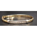 CZ SET NINE CARAT GOLD BANGLE approximately 7.5 grams