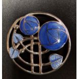 BLUE ENAMEL DECORATED SILVER BROOCH the circular brooch with Mackintosh rose decoration, 3.7cm