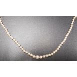 GRADUATED CULTURED PEARL NECKLACE with diamond set eighteen carat gold clasp, 46cm long