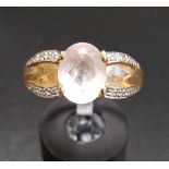 KUNZITE AND DIAMOND DRESS RING the central oval cut kunzite flanked by diamond set shoulders, on
