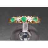 EMERALD AND DIAMOND FIVE STONE RING the alternating diamonds and emeralds on ten carat gold shank,