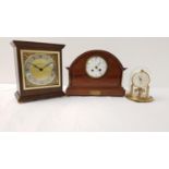 SHAPED MAHOGANY CASED MANTLE CLOCK the circular dial with Arabic numerals, with a presentation