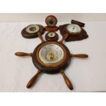 SELECTION OF ANEROID BAROMETERS one circular shaped contained in a ships wheel, one of shaped