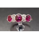 RUBY AND DIAMOND RING the three rubies separated by diamonds, on nine carat gold shank with platinum