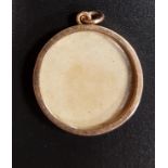 NINE CARAT GOLD MOUNTED CIRCULAR LOCKET PENDANT one side with glazed panel, 2.5cm diameter