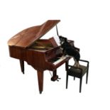 HUPFELD MAHOGANY CASED BABY GRAND PIANO the metal frame marked 145, standing on tapering supports