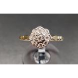 DIAMOND CLUSTER RING the diamonds totalling approximately 0,27cts, on eighteen carat gold shank,