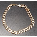 NINE CARAT ROSE GOLD CURB LINK BRACELET approximately 15 grams and 24cm long