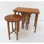 NEST OF TEAK OCCASIONAL TABLES with a rectangular top standing on tapering supports with castors,