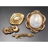 FOUR VICTORIAN AND EDWARDIAN PINCHBECK BROOCHES including a double sided glass locket example, and a