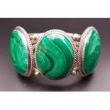 LARGE MALACHITE SET SILVER BRACELET with three oval malachite sections, with indistinct maker's mark