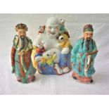 19TH CENTURY CHINESE PORCELAIN FIGURE of a wise man in traditional dress holding a ruyi, 25cm