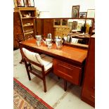 G PLAN TEAK KNEEHOLE DRESSING TABLE with an oblong mirror back above a central flush fitting