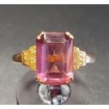 PINK GEM SET SINGLE STONE RING on nine carat gold shank with stepped shoulders, ring size P