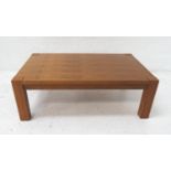 WALNUT OCCASIONAL TABLE of rectangular form standing on plain supports, 120cm wide