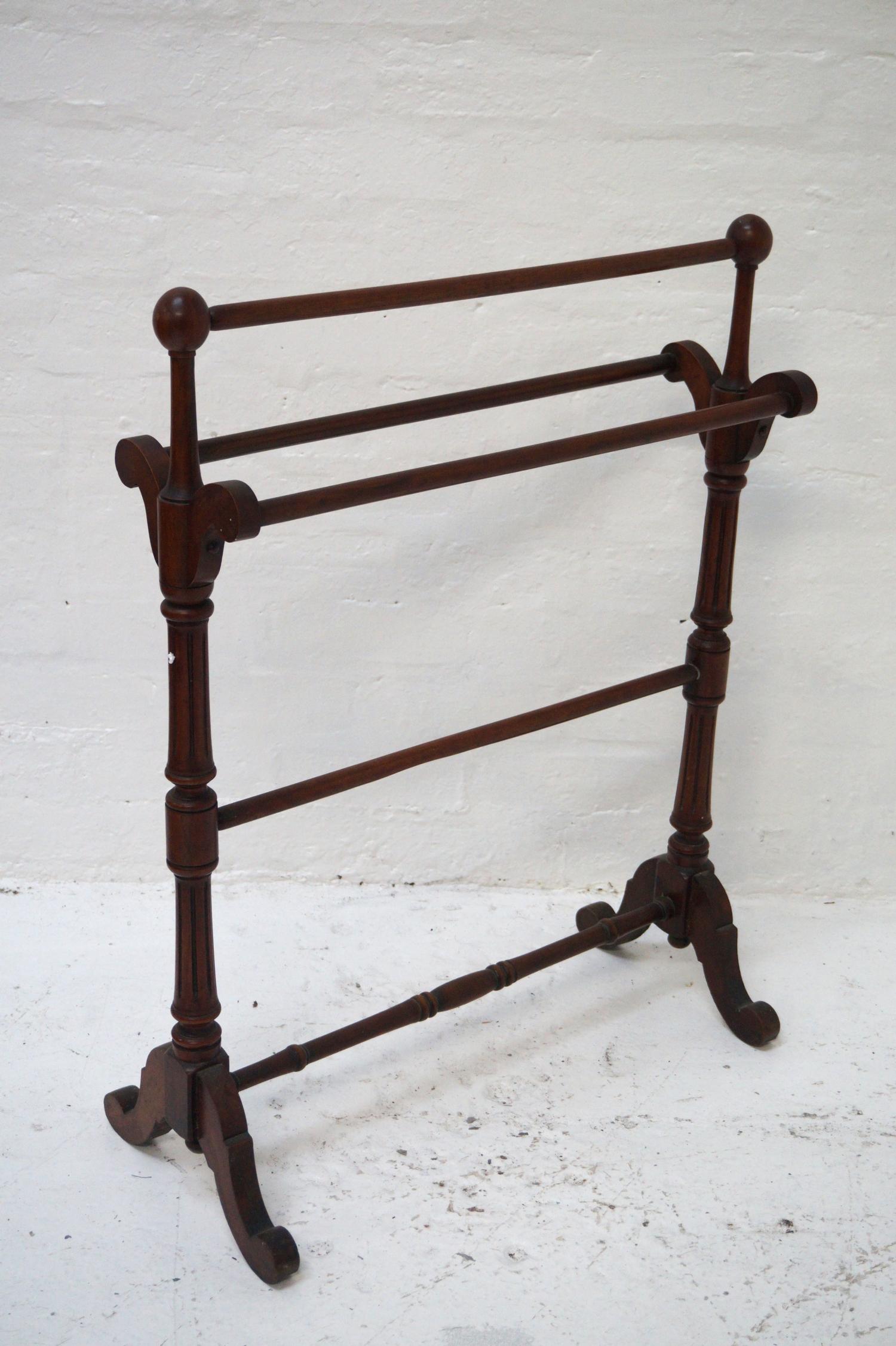 19th CENTURY MAHOGANY TOWEL RAIL raised on turned and tapering columns with splayed supports