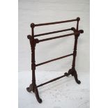 19th CENTURY MAHOGANY TOWEL RAIL raised on turned and tapering columns with splayed supports