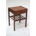 TEAK BEDSIDE OR TELEPHONE TABLE with a square top above a frieze drawer, standing on plain