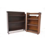 STAINED PINE BOOKCASE with a shaped raised back above three shelves, 84cm high; together with a