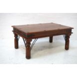 TEAK OBLONG OCCASIONAL TABLE with decorative ironwork standing on turned supports, 90cm wide