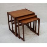 G PLAN TEAK NEST OF TABLES standing on shaped supports, the largest 53.5cm wide