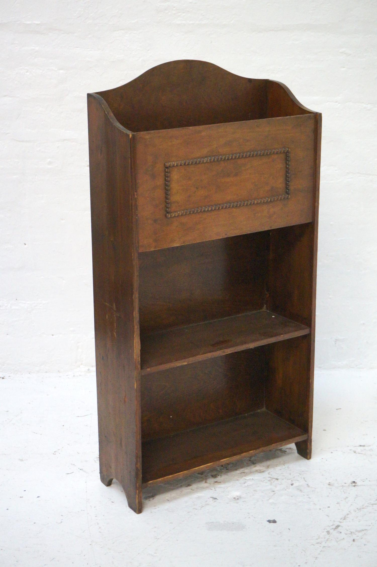 STAINED PINE MAGAZINE RACK/BOOK CASE the shaped top with bead detail above two open shelves, 89cm