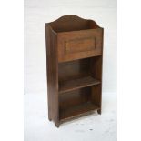 STAINED PINE MAGAZINE RACK/BOOK CASE the shaped top with bead detail above two open shelves, 89cm