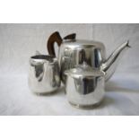 PICQUOT WARE TEA SET comprising a tea pot, milk jug and lidded sugar bowl (3)