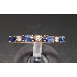 SAPPHIRE AND DIAMOND HALF ETERNITY RING with alternating marquise cut sapphires and round