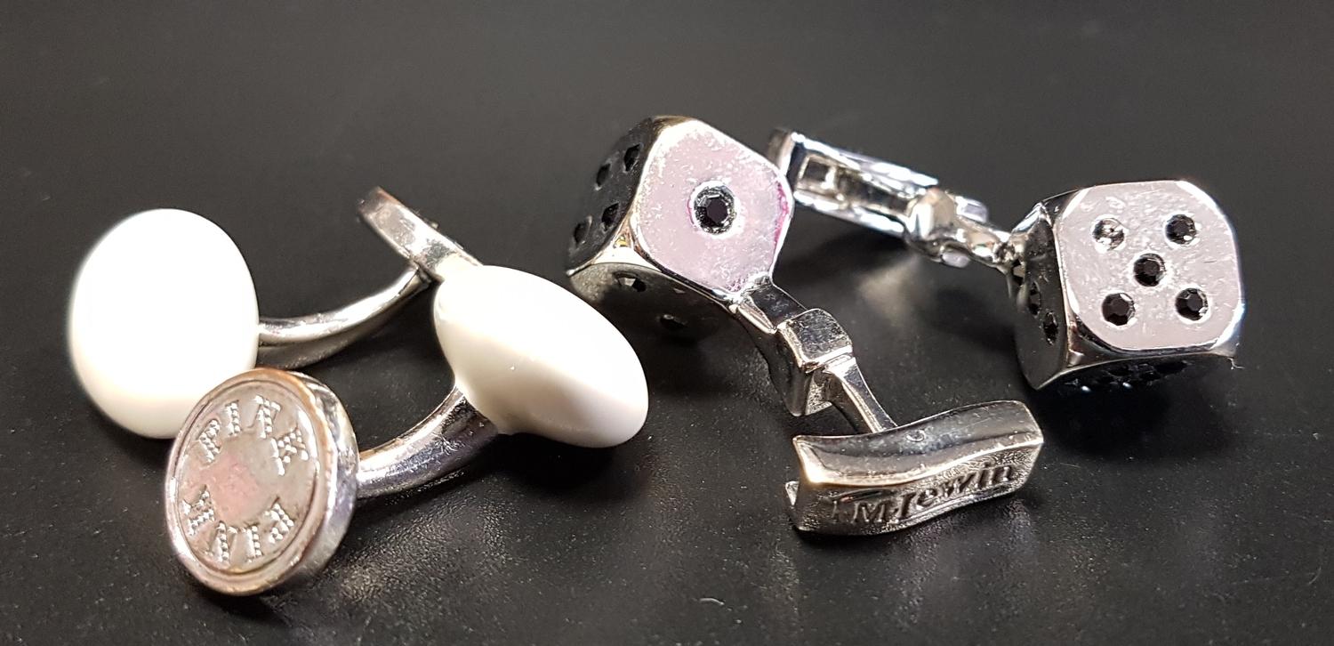 TWO PAIRS OF CUFFLINKS comprising a white enamel decorated pair by Thomas Pink; and a boxed T. M.